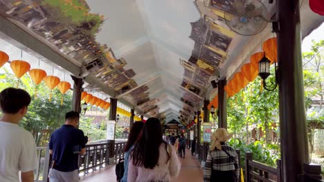 Hallway-at-the-entrance-of-the-cable-car-ride-at-Sunworld-Amusement-Park-full-of-people,-Walking-forward-shot