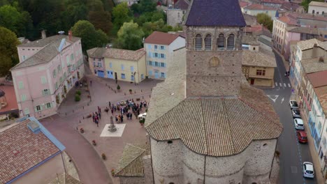 Provence,-France---French-Guests-And-Visitors-Gathered-Outside-The-Church-Together-With-The-Newly-Wed-Couple-After-The-Wedding-Ceremony---Aerial-Drone-Shot