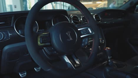 Close-Up-on-Cobra-Logo-on-Steering-Wheel-of-Ford-Mustang-Shelby