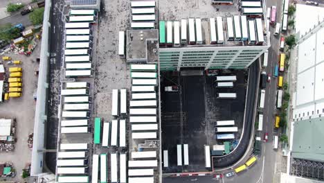 Hong-Kong-multilevel-double-decker-Citybus-depot-and-terminal-in-downtown-Hong-Kong,-Aerial-view