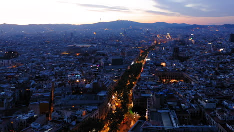 Aerial-view-of-Barcelona-at-sunrise,-Spain