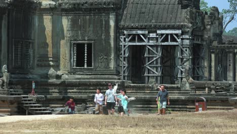 Medium-Exterior-Shot-of-Tourist-Walking-at-Temple-Area