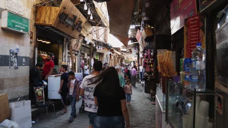 Steady-shot-of-a-bazaar-in-Syria-visited-by-groups-of-people
