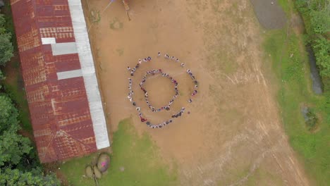 Students-spreading-out-from-the-circle-in-a-School-ground,-Manipur