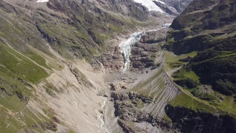 Aerial-view-of-a-glacial-valley-in-the-turistic-region-of-Grindelwald-in-the-Swiss-alps