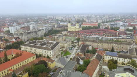 Drone-footage-from-the-Church-at-Debrecen-citys-main-squarein-rainy-weather-autumn-Drone-flies-fast-backwards-and-up