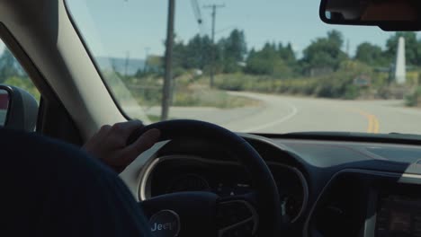 Man-Driving-His-Jeep-SUV-Down-the-Road-to-Adventure