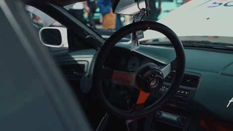 Quick-Disconnect-Steering-Wheel-Hanging-in-Nissan-240SX-Interior