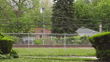 a-Railway-Train-races-past-a-suburban-neighborhood