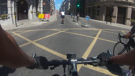 Cyclists-Down-King-William-Street-In-Central-London,-Follow-Shot,-POV