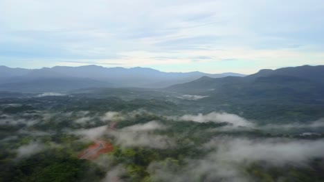 Aerial-360-view-of-jungle-rainforest-covered-in-fog