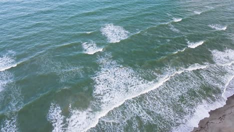 Florida-Surf-Spot-at-Cocoa-Beach,-Aerial-Establishing-Flyover