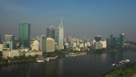 Drone-view-of-Saigon-River,-Ho-Chi-Minh-City-on-a-sunny-day