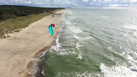 AERIAL:-Surfer-Riding-Waves-Very-Close-to-Baltic-Sea-Shore