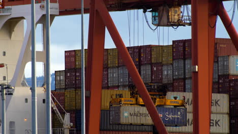 Harbor-Crane-Lifting-Two-Cargo-Containers-At-Once-In-Vancouver-Port-In-Canada