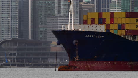 Conti-Lyon-Container-Ship-With-Cargos-Docked-At-Vancouver-Port-Near-Downtown-In-Pacific-Northwest,-BC,-Canada