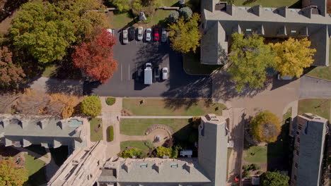 Overhead-flyover-of-Seminary,-church,-city-park,-and-residential-neighborhood-in-Autumn