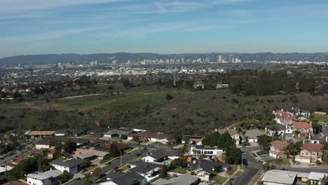 Aerial-shot-of-a-park-with-downtown-Los-Angeles-in-the-background