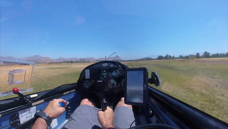 Glider-filmed-from-the-inside-landing-on-a-grass-airfield,-in-Ful-HD-at-60-fps