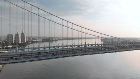 Sunrise-aerial-drone-footage-of-Benjamin-Franklin-Bridge-in-Philadelphia