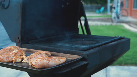 Various-shots-of-grilling-and-cooking-chicken-on-an-apartment-style-BBQ-grill