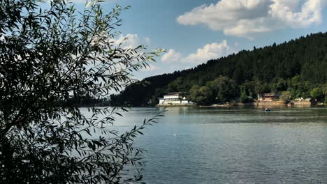 Reveal-shot-of-the-Pancharevo-Lake,-Bulgaria,-with-a-smooth-camera-pan-from-left-to-right