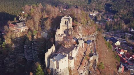 Aerial-view-of-an-old-castle-ruins,-in-Germany,-Kurort-Oybin