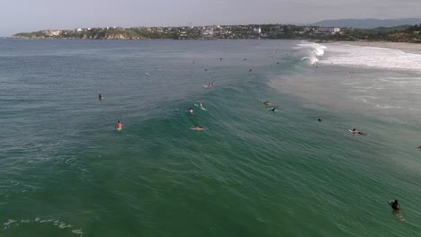Slow-Motion:-Aerial-shot-of-a-surfer-surfing-a-tube-barrel-wave-in-Zicatela-beach-Puerto-Escondido,-Oaxaca