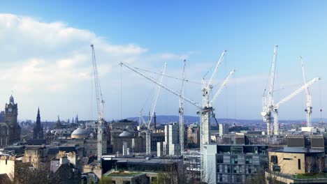 Edinburgh-city-skyline,-dominated-by-construction-cranes-working-on-new-developments