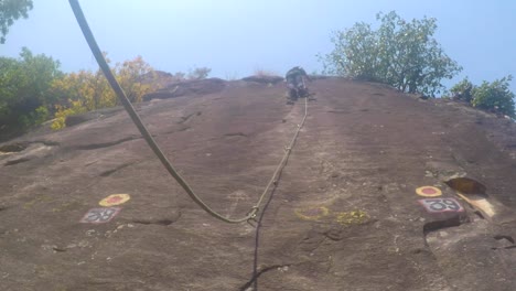 Rock-climbing-by-professional-mountaineer-of-a-reputed-mountaineering-institute-in-upper-Himalayas,-Uttarakhand-India