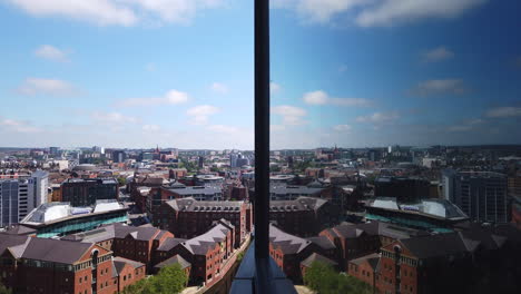 Time-Lapse-of-Leeds-City-Centre-Skyline-on-Sunny-Summer’s-Day-with-Fast-Moving-White-Clouds---Reflections-from-High-Rise-Building’s-Window