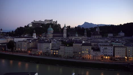 Salzburg-baroque-skyline-at-dusk-with-the-mountains-of-the-alps-in-the-background-viewed-from-the-Kapuzinerberg