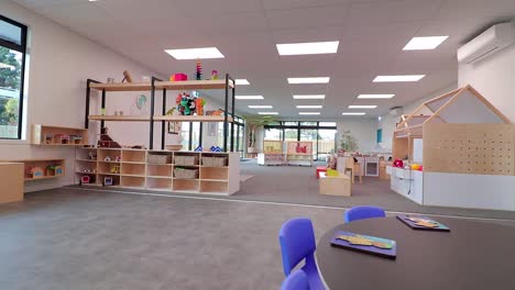 Dolly-in-showing-a-modern-learning-space-for-kids-in-a-Playcentre,-New-Zealand