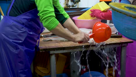 merchant-make-sushi-from-live-fish-in-Korean-seafood-market-in-busan-people-buy-and-sell-fresh-seafood-and-fish-in-seafood-market-in-south-korea