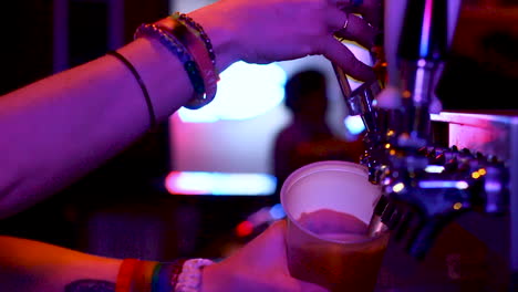 bartender-pouring-a-beer-at-the-bar-club