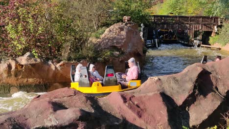 People-having-fun-with-donnerfluss-the-river-rapids-ride-going-to-station-level-at-the-end-of-the-ride
