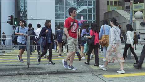Pedestrians-using-a-road-crossing-during-morning-rush-hour-in-the-Central-district