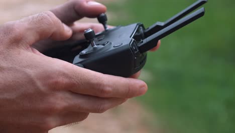 Close-Shot-of-Drone-Operator-Using-a-Drone-Controller
