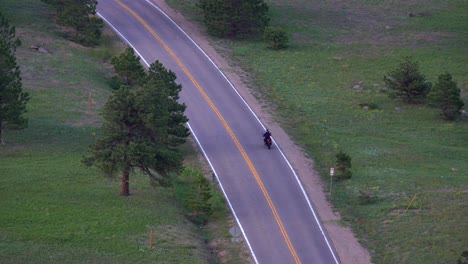 Aerial-view-of-motorcycle-riding-in-the-mountains