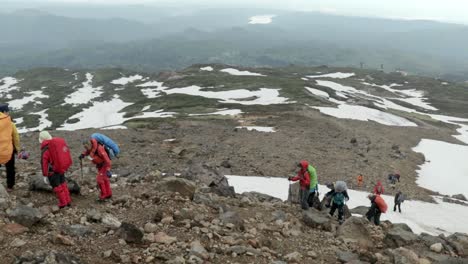 Group-of-mountaineers-climbing-up-famous-volcano-Mount-Asahidake-in-Japan