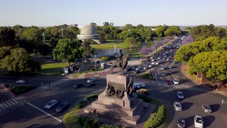 Aerial-shot-of-rush-hour-traffic-driving-near-Galileo-Galilei-Planetarium,-Buenos-Aires