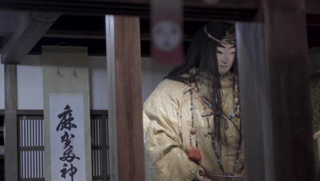 View-through-a-window-to-a-big-traditional-japanese-statue