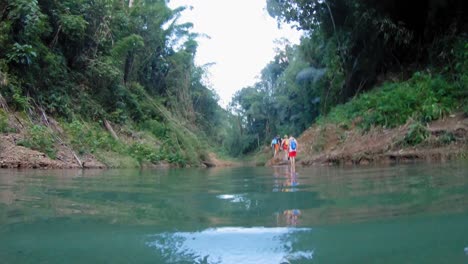 Swimming-in-Khao-Sok-river,-pov-shot