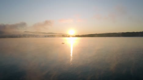 First-ray-of-sunshine-over-a-lake