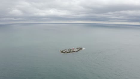 Aerial-capture-of-The-Muglins-Lighthouse-during-a-cloudy-day