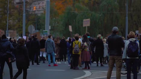 People-Wearing-Masks-On-The-Street-Of-Szczecin,-Poland---Protesting-Against-Abortion-Ban-Amidst-Coronavirus-Pandemic---wide-shot,-slow-motion