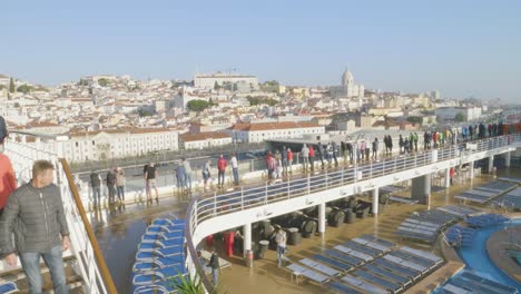 A-view-of-a-town-near-the-port-of-Valencia-from-a-cruise-ship-with-tourists,-Spain