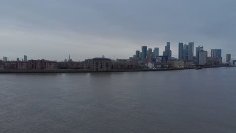 Rising-drone-shot-of-canary-wharf-Isle-of-dogs-London-in-the-evening