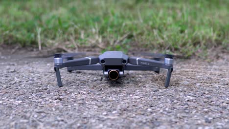 Drone-Taking-Off-From-The-Ground-In-Saitama,-Japan---DJI-Mavic-2-Pro---Closeup-Shot