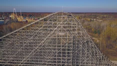 Aerial-push-out-of-rollercoaster-at-shut-down-amusement-park,-Michigan
